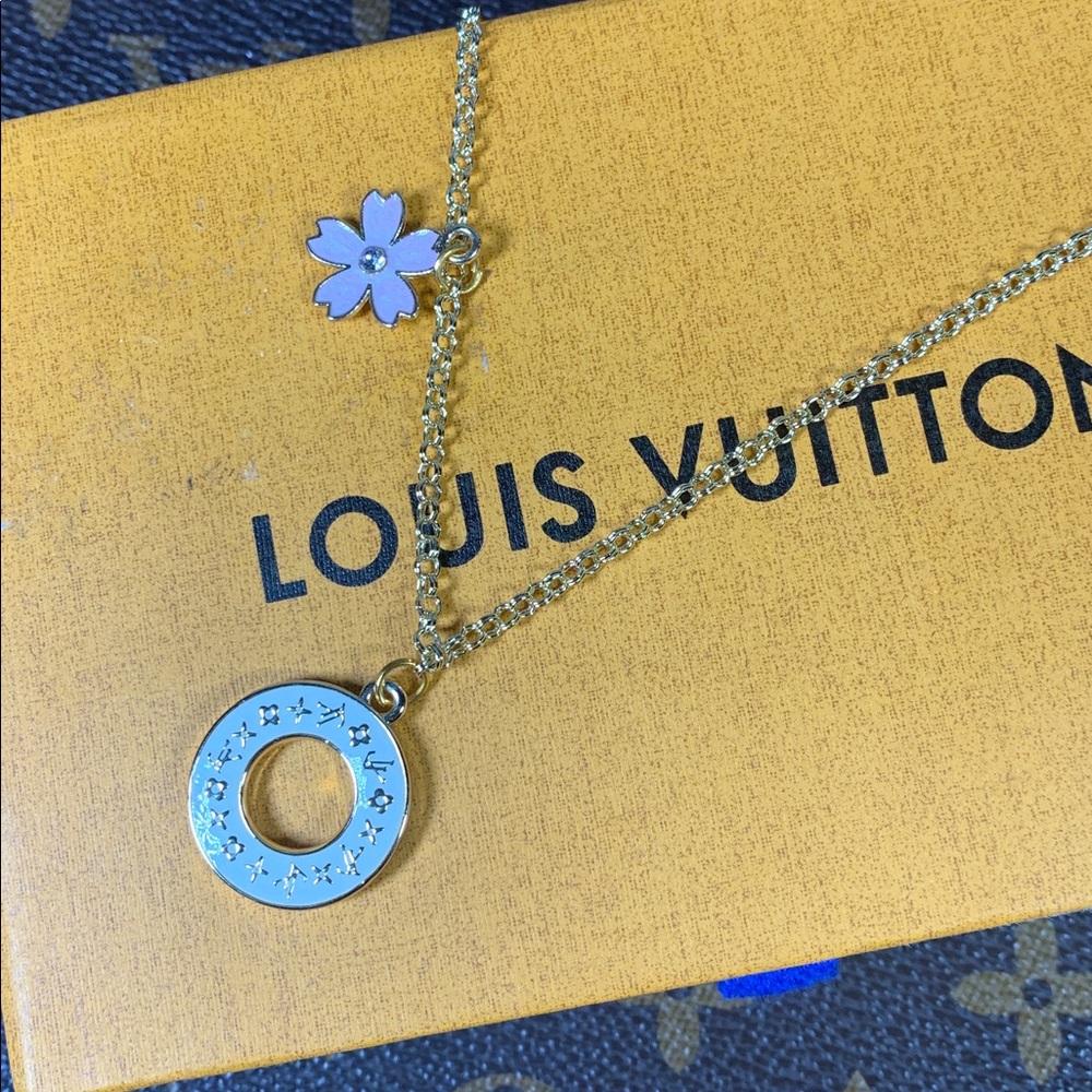 Gorgeous Upcycled Louis Vuitton white doughnut charm on 18ct gold plated chain
